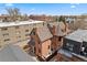 Aerial view of brick home with a rooftop and surrounding neighborhood at 1763 N Williams St # 101, Denver, CO 80218