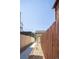 Backyard view features pathway, fenced yard and access to a detached garage or storage area at 1763 N Williams St # 101, Denver, CO 80218