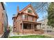 Beautiful two-story red brick home with detailed architectural features and a well-maintained yard at 1763 N Williams St # 101, Denver, CO 80218