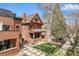 Stunning red brick home with a well-manicured front yard and modern adjacent architecture at 1763 N Williams St # 101, Denver, CO 80218