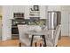 Charming kitchen featuring stainless steel appliances, modern cabinets, and a cozy dining table at 1763 N Williams St # 101, Denver, CO 80218