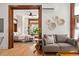 Cozy living room featuring wood trim, hardwood floors, and stylish decor at 1763 N Williams St # 101, Denver, CO 80218