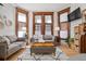 Inviting living room with hardwood floors, large windows, and comfortable seating at 1763 N Williams St # 101, Denver, CO 80218