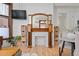 Living room with a decorative fireplace, hardwood floors and built-in shelving at 1763 N Williams St # 101, Denver, CO 80218