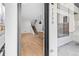 Bright entryway with wood floors, a modern staircase, and an open floor plan at 1254 Yates St, Denver, CO 80204