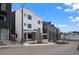 Modern townhome exterior featuring clean lines, black window frames, and new construction at 1254 Yates St, Denver, CO 80204