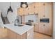 Modern kitchen with an island, stainless appliances, and stylish wood cabinets at 1254 Yates St, Denver, CO 80204