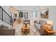 An open-concept living room featuring hardwood floors, modern furniture, and natural light at 1254 Yates St, Denver, CO 80204