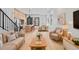 A modern open-concept living area featuring hardwood floors, a dining table, and stylish neutral-toned furniture at 1254 Yates St, Denver, CO 80204