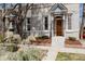 Charming home exterior with a well-kept front yard, beautiful front door, and classic architectural details at 2841 W 27Th Ave, Denver, CO 80211