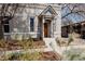 Charming home with a welcoming front porch, beautifully landscaped yard, and unique architectural features at 2841 W 27Th Ave, Denver, CO 80211