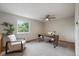 Well-lit bedroom with a modern desk, cozy chair, and neutral tones at 10961 Gray Cir, Westminster, CO 80020
