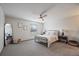 Bright bedroom featuring plush carpet, ceiling fan, comfortable bed and stylish decor at 10961 Gray Cir, Westminster, CO 80020