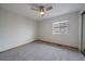 Bright bedroom with a ceiling fan, neutral paint, and plush carpet at 10961 Gray Cir, Westminster, CO 80020