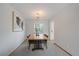 Modern dining room with stylish light fixture and a wooden table set for four at 10961 Gray Cir, Westminster, CO 80020