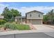 Charming two-story home featuring a manicured lawn and a brick-accented facade at 10961 Gray Cir, Westminster, CO 80020