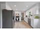 Well-lit kitchen with stainless steel appliances, white cabinetry, and sleek countertops at 10961 Gray Cir, Westminster, CO 80020