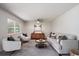 Inviting living room featuring neutral decor, comfortable seating, and natural light at 10961 Gray Cir, Westminster, CO 80020