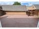 Wooden back deck with painted boards and privacy fence at 13187 E Bethany Pl, Aurora, CO 80014