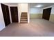 Basement area with carpet, finished walls and storage area at 13187 E Bethany Pl, Aurora, CO 80014