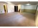 Spacious carpeted basement with neutral walls, built-in closet, and stairway to other floors at 13187 E Bethany Pl, Aurora, CO 80014