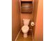 Powder room with a toilet, wooden storage and wooden-style vinyl flooring at 13187 E Bethany Pl, Aurora, CO 80014