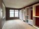 Bedroom featuring built in closet system, two windows and carpet at 13187 E Bethany Pl, Aurora, CO 80014