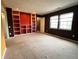 Bedroom area featuring built in shelves, two windows and carpet at 13187 E Bethany Pl, Aurora, CO 80014