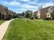 Lush common area with sidewalks between homes in a well-maintained community at 13187 E Bethany Pl, Aurora, CO 80014