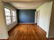 Spacious living room featuring gleaming hardwood floors, neutral paint, and ample natural light at 13187 E Bethany Pl, Aurora, CO 80014