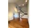 Open concept living room featuring high ceilings, staircase and hardwood flooring, bathed in natural light at 13187 E Bethany Pl, Aurora, CO 80014