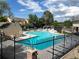 Community pool area with fencing and lounge seating provides a relaxing outdoor experience at 13187 E Bethany Pl, Aurora, CO 80014