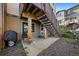 Cozy back patio area with staircase, perfect for outdoor relaxation and entertainment at 11811 E Maplewood Ave, Englewood, CO 80111
