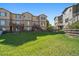 Townhome backyard featuring a well-maintained lawn and fences at 11811 E Maplewood Ave, Englewood, CO 80111