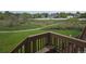 View of a community backyard with a walking path and greenery, seen from a deck at 11811 E Maplewood Ave, Englewood, CO 80111