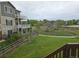 Three-story condo unit with backyard view, complete with multiple decks and a spiral staircase at 11811 E Maplewood Ave, Englewood, CO 80111