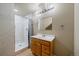 Updated bathroom with a glass-enclosed shower and sleek vanity at 11811 E Maplewood Ave, Englewood, CO 80111