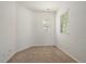 Cozy bedroom with neutral paint and plush carpeting at 11811 E Maplewood Ave, Englewood, CO 80111