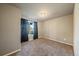 Bedroom featuring plush carpet, natural light, and modern black out curtains at 11811 E Maplewood Ave, Englewood, CO 80111