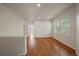Bonus room with hardwood floors, neutral paint, recessed lighting, and many windows at 11811 E Maplewood Ave, Englewood, CO 80111