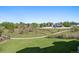 Scenic view of community green space with walking path and lush greenery at 11811 E Maplewood Ave, Englewood, CO 80111