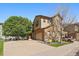 Charming two-story home features a spacious driveway, well-kept lawn, and appealing exterior paint scheme at 11811 E Maplewood Ave, Englewood, CO 80111