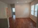Bright living room featuring hardwood floors, white trim, and windows with natural light at 11811 E Maplewood Ave, Englewood, CO 80111