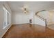 Open living area with hardwood floors, a cozy fireplace, and natural light at 11811 E Maplewood Ave, Englewood, CO 80111