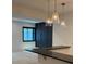 Elegant bar area features pendant lighting and sleek countertop, great for entertaining guests at 2442 S Saint Paul St, Denver, CO 80210