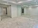 Spacious basement flex space with mirrored walls, recessed lighting, and glass paneled double doors at 2442 S Saint Paul St, Denver, CO 80210