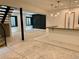 Unfinished basement boasting a wet bar area, black accent wall, and egress windows providing natural light at 2442 S Saint Paul St, Denver, CO 80210