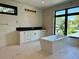 Bright bathroom featuring a soaking tub and a white vanity with black countertop at 2442 S Saint Paul St, Denver, CO 80210