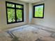 This spacious room has large windows overlooking mature trees, offering natural light at 2442 S Saint Paul St, Denver, CO 80210