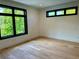 Bright bedroom featuring hardwood floors and large windows at 2442 S Saint Paul St, Denver, CO 80210